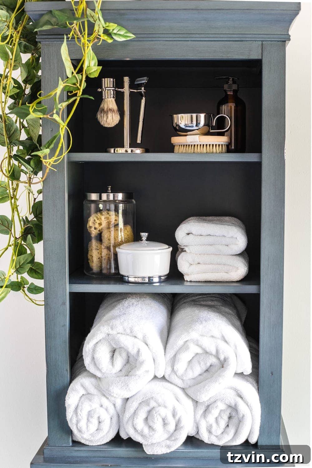 Master Bathroom Makeover: Stunning Results On A Budget 20 Organized linen cabinet interior with rolled towels and bath essentials