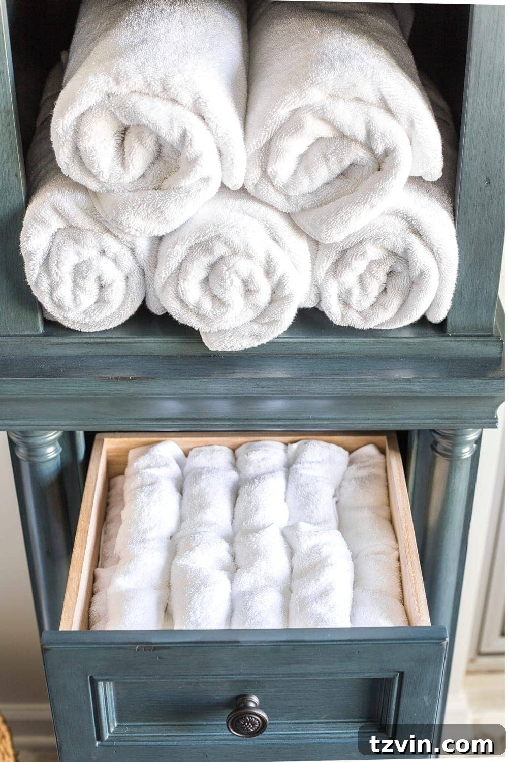 Master Bathroom Makeover: Stunning Results On A Budget 21 Drawer inside linen cabinet showing neatly folded washcloths