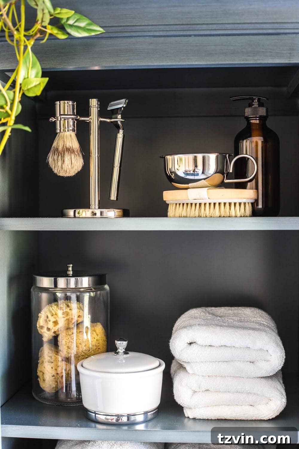 Master Bathroom Makeover: Stunning Results On A Budget 23 Inside view of linen cabinet with DIY hamper, before filling