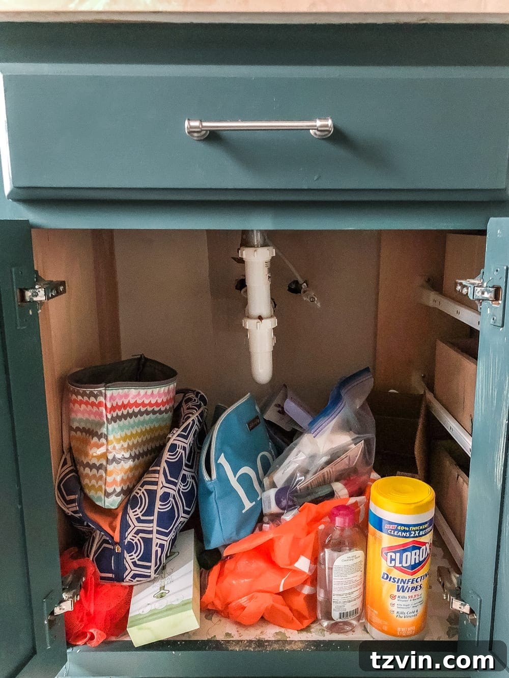 Master Bathroom Makeover: Stunning Results On A Budget 9 Under-sink bathroom cabinet showing organized stackable basket drawers