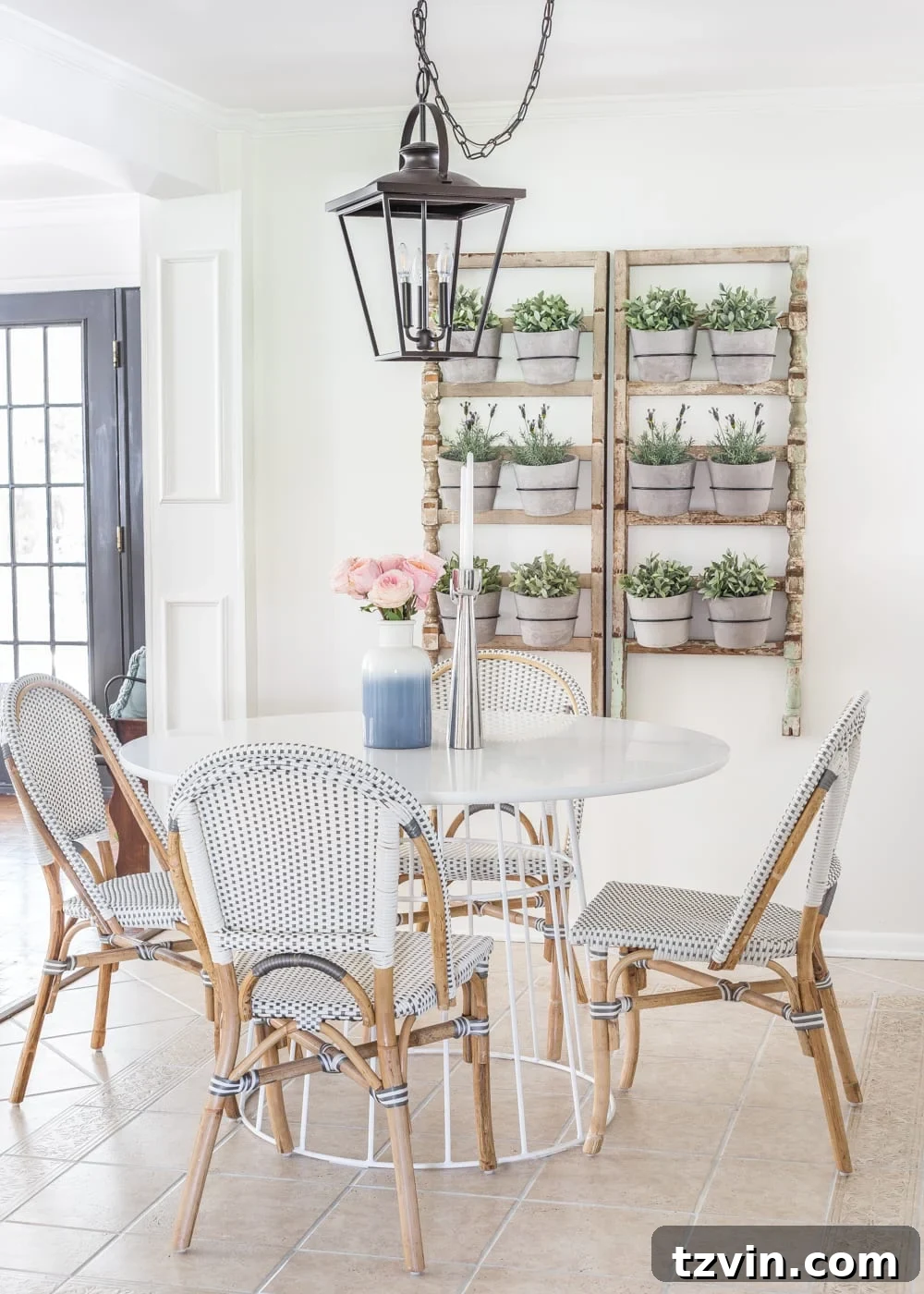 My Spring Oasis: A Home Tour 11 Breakfast nook with French bistro chairs, a wall planter made from antique banisters, and a large dining table.