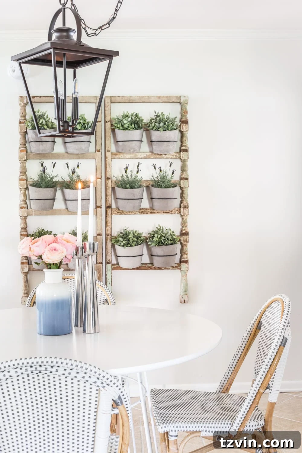 My Spring Oasis: A Home Tour 12 Cozy breakfast nook decorated for spring, featuring a bouquet of pink cabbage roses on the table.