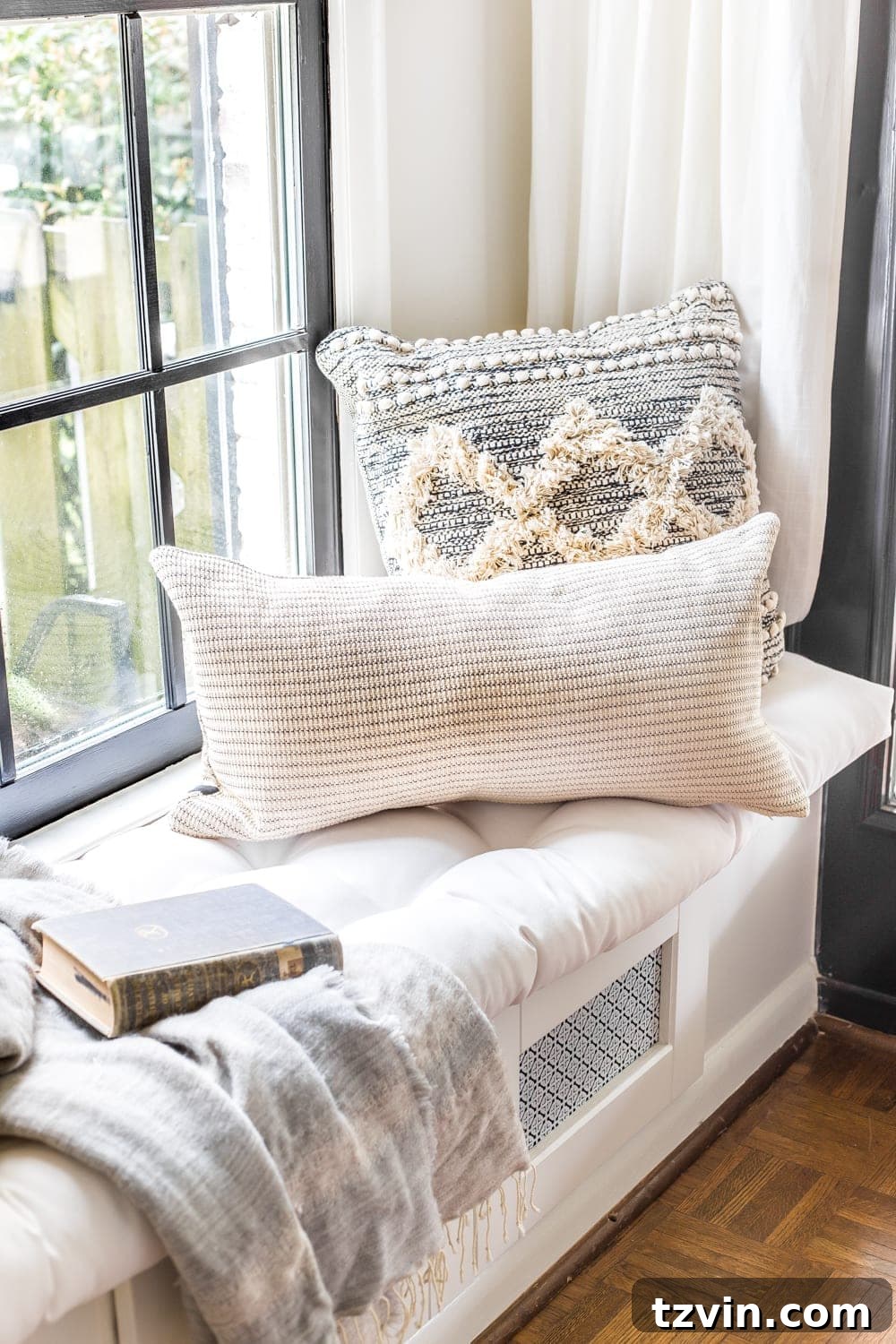 My Spring Oasis: A Home Tour 16 Living room accent chair adorned with neutral and subtle green pillows for spring.