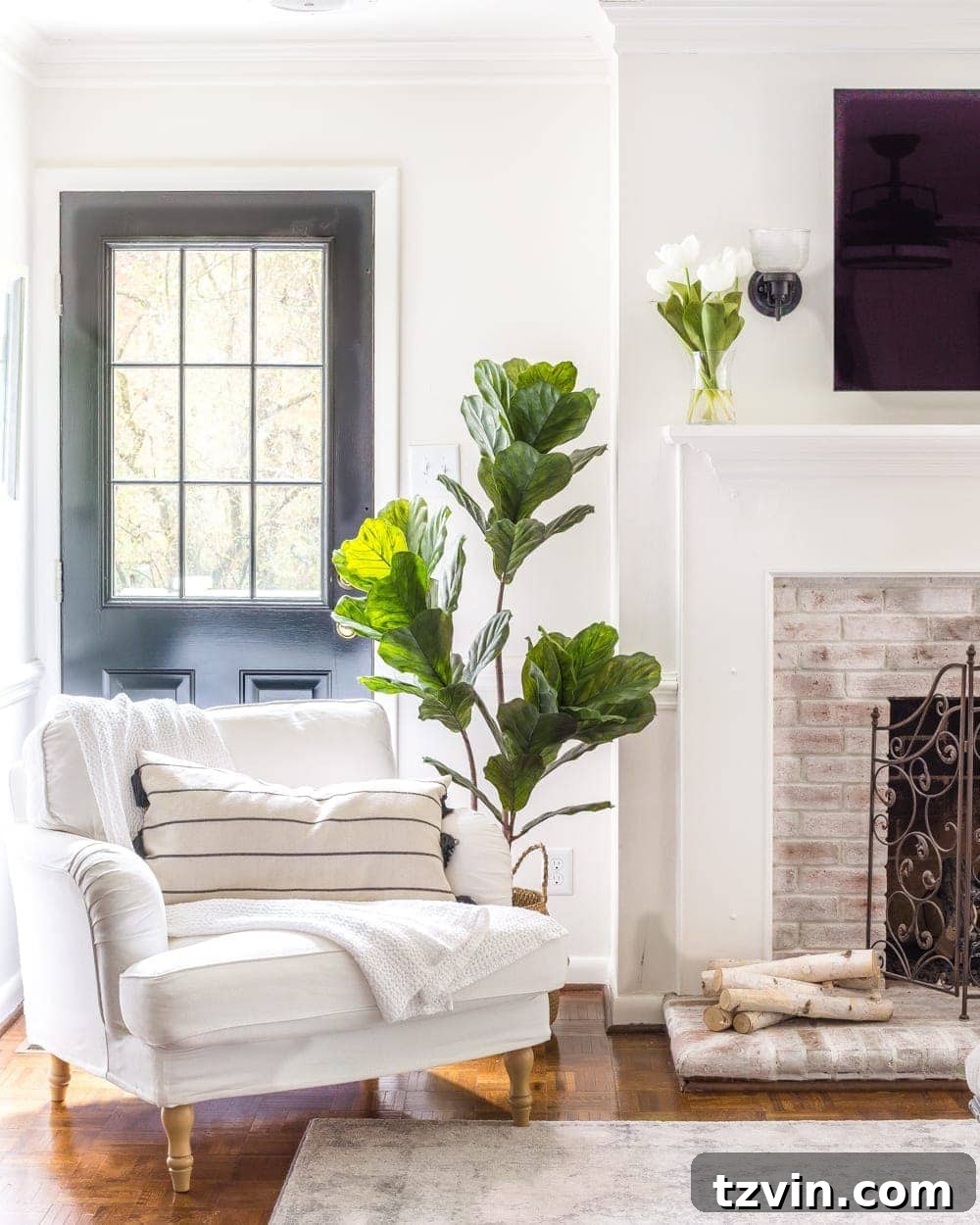 My Spring Oasis: A Home Tour 19 Living room with an artificial fiddle leaf fig tree, IKEA furniture, and comfortable seating.