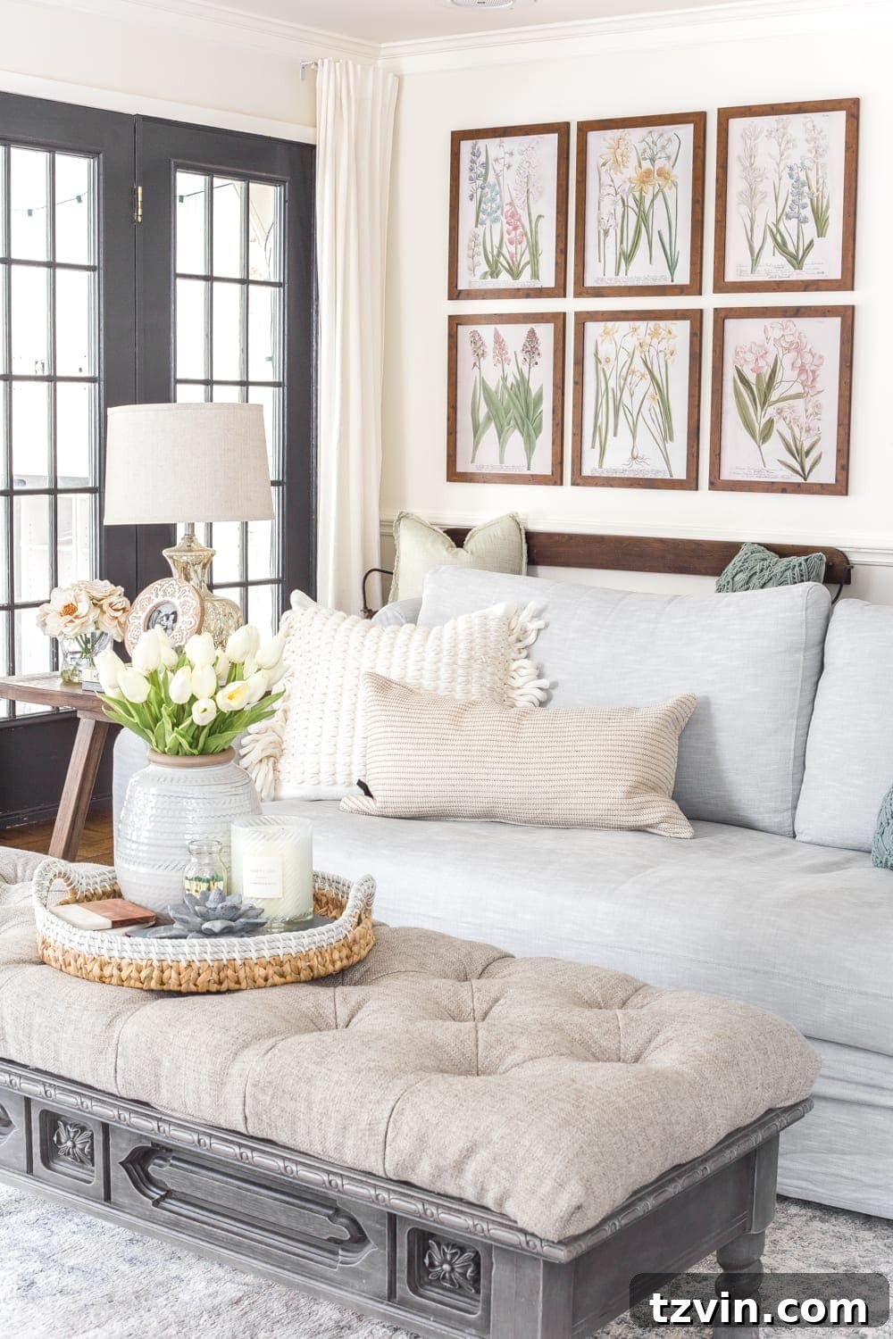 My Spring Oasis: A Home Tour 22 Neutral living room featuring artificial florals and subtle spring touches, creating a cozy family space.