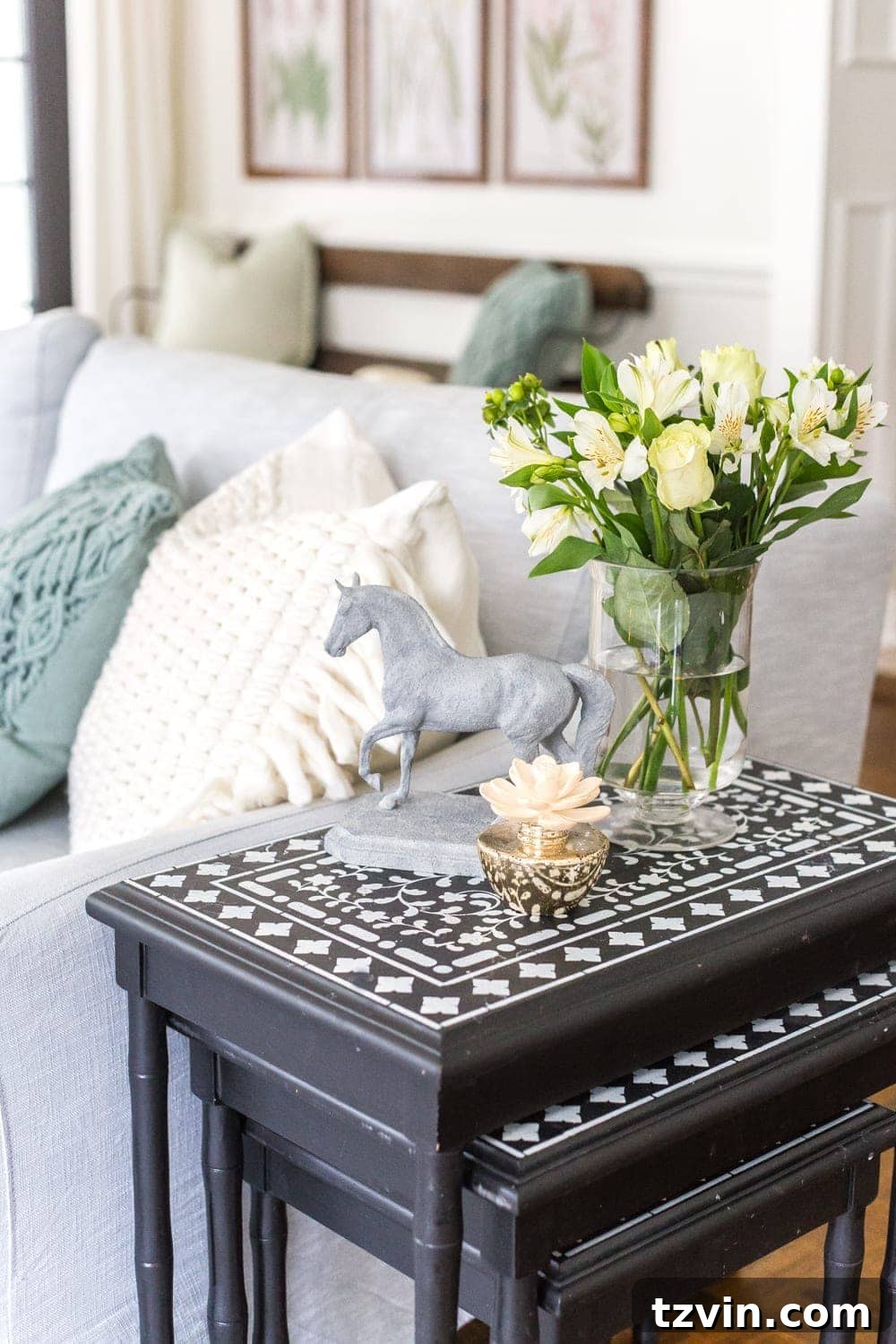 My Spring Oasis: A Home Tour 23 Inviting living room with neutral furnishings, artificial greenery, and warm, natural light.
