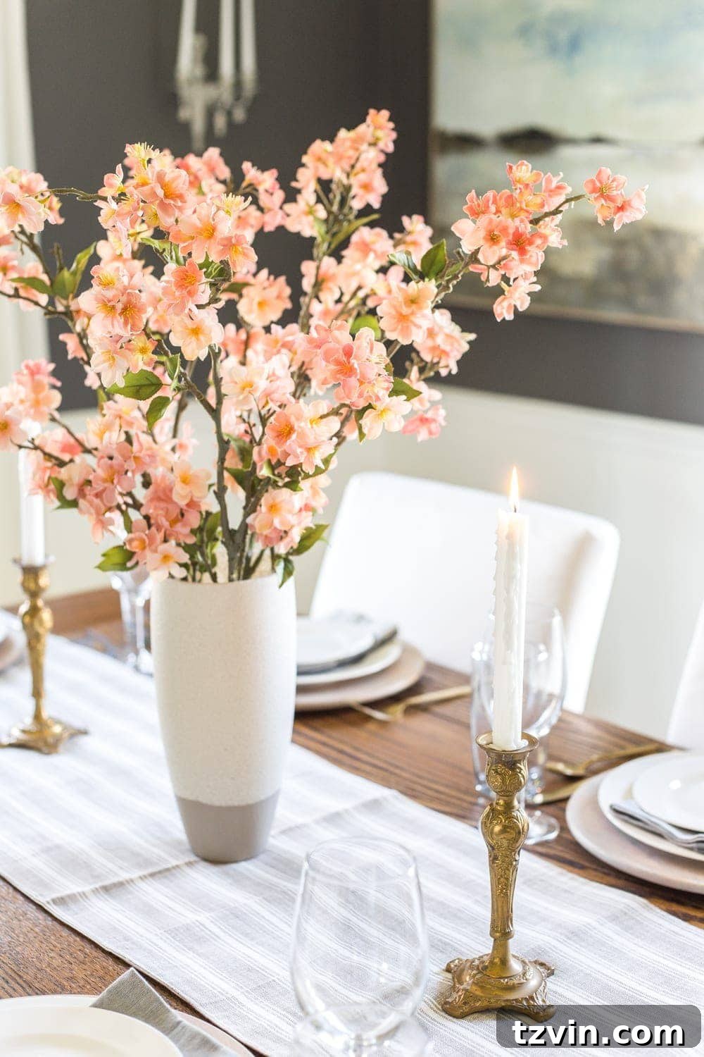 My Spring Oasis: A Home Tour 4 Close-up of a dining table centerpiece featuring realistic faux pink cherry blossoms.