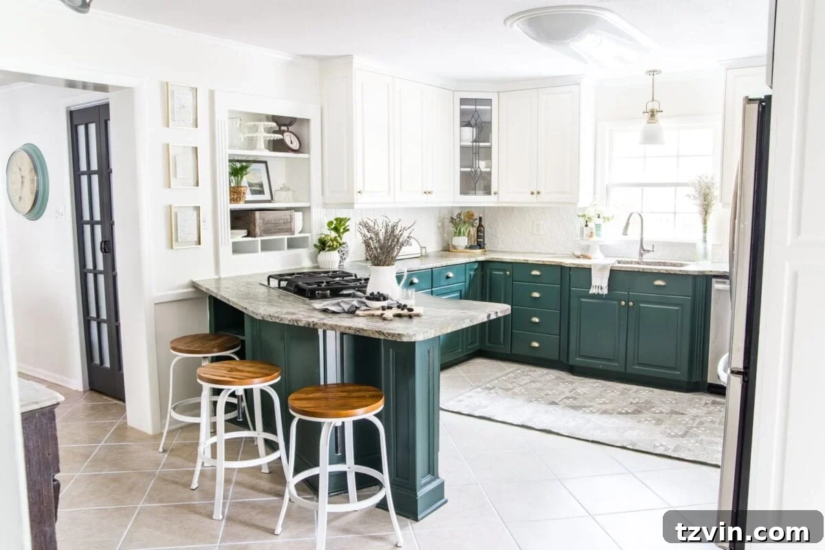 Two Years In: Our Home's Stunning Before and After 13 After image of a refreshed kitchen with two-toned cabinets (green lowers, white uppers), open shelving, and modern farmhouse elements.