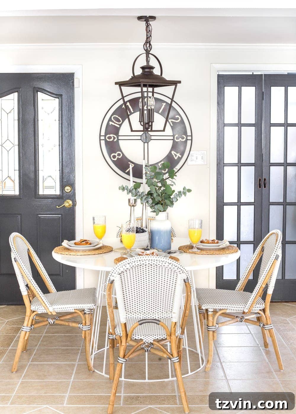 Two Years In: Our Home's Stunning Before and After 18 After image of a cozy Scandinavian-farmhouse breakfast nook with a built-in bench, wooden table, and natural light.