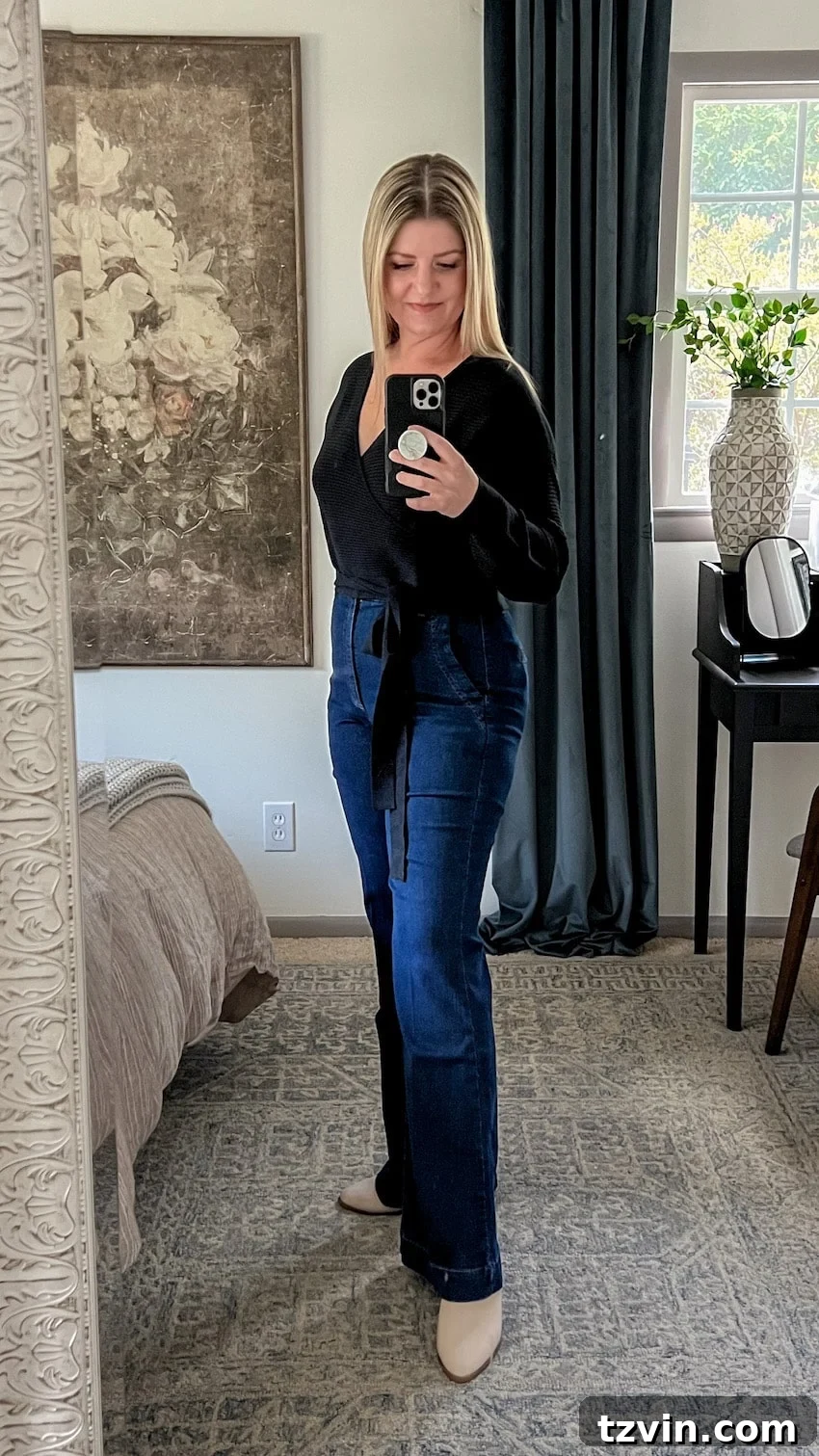 black wrap top and trouser jeans outfit to hide a belly