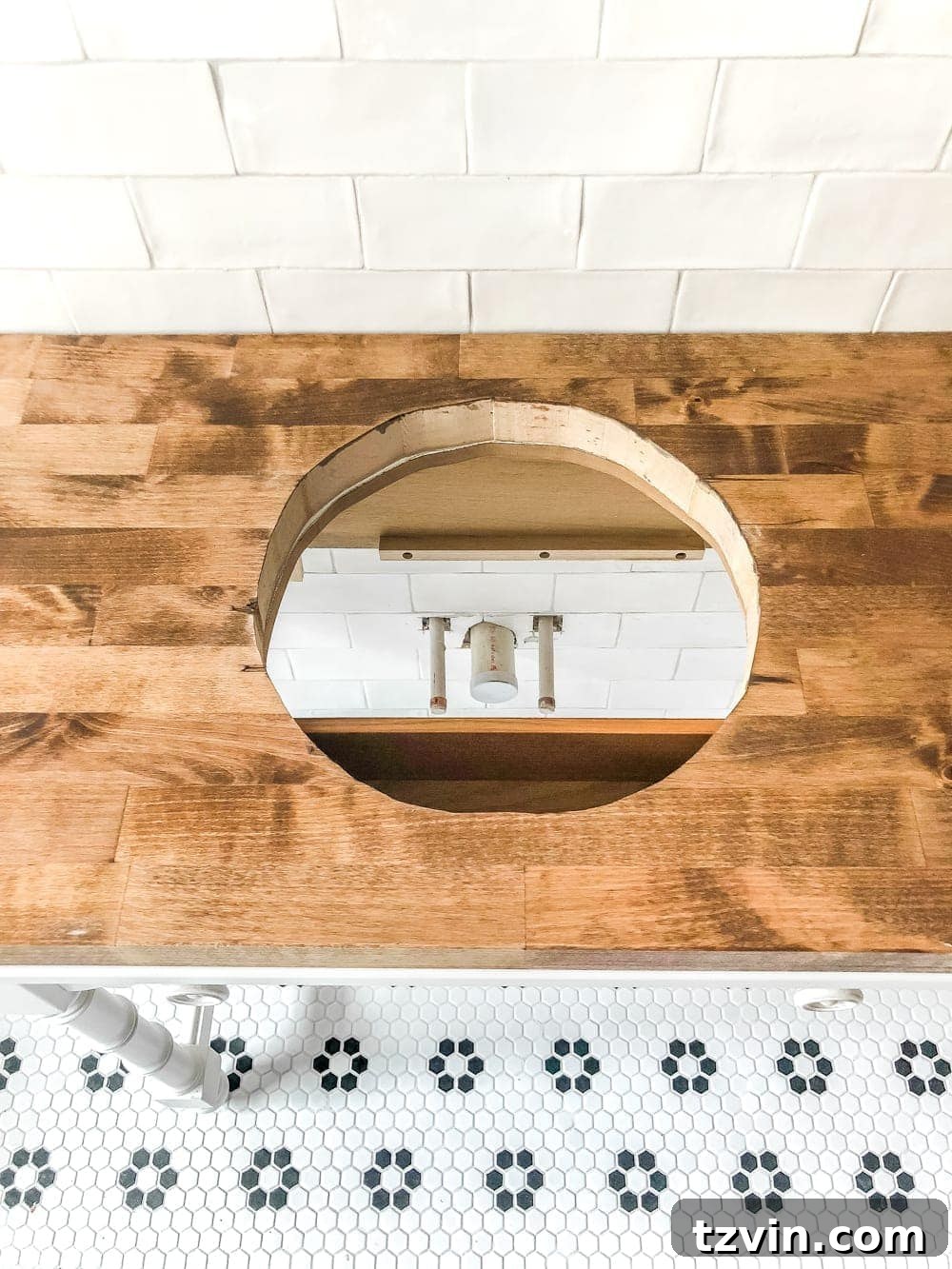 Upcycling a Console Table into a Chic Bathroom Vanity 13 Staining and waterproofing the butcher block countertop with Minwax Special Walnut and Spar Urethane