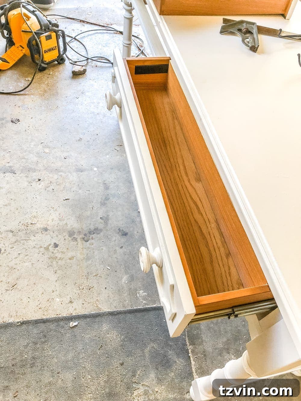 Upcycling a Console Table into a Chic Bathroom Vanity 7 Installing a drawer stopper with a piece of scrap wood