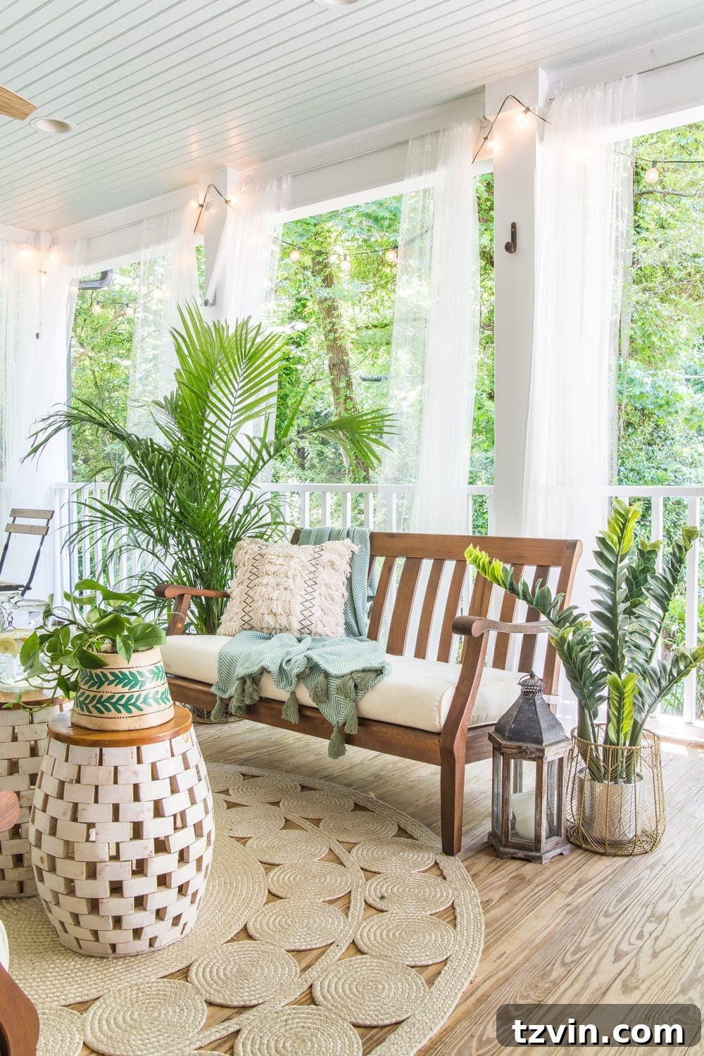 Cozy seating area with string lights and tropical boho decor on a back porch, perfect for evening ambience.