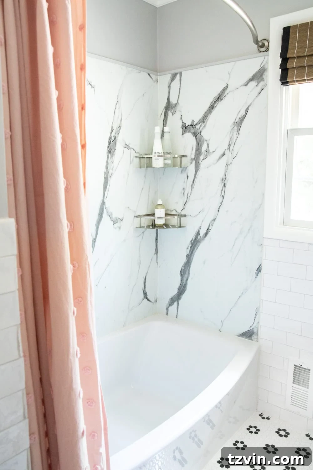 Tiny Humans Big Bathroom Makeover 12 Ovation tub integrated into the faux marble shower area