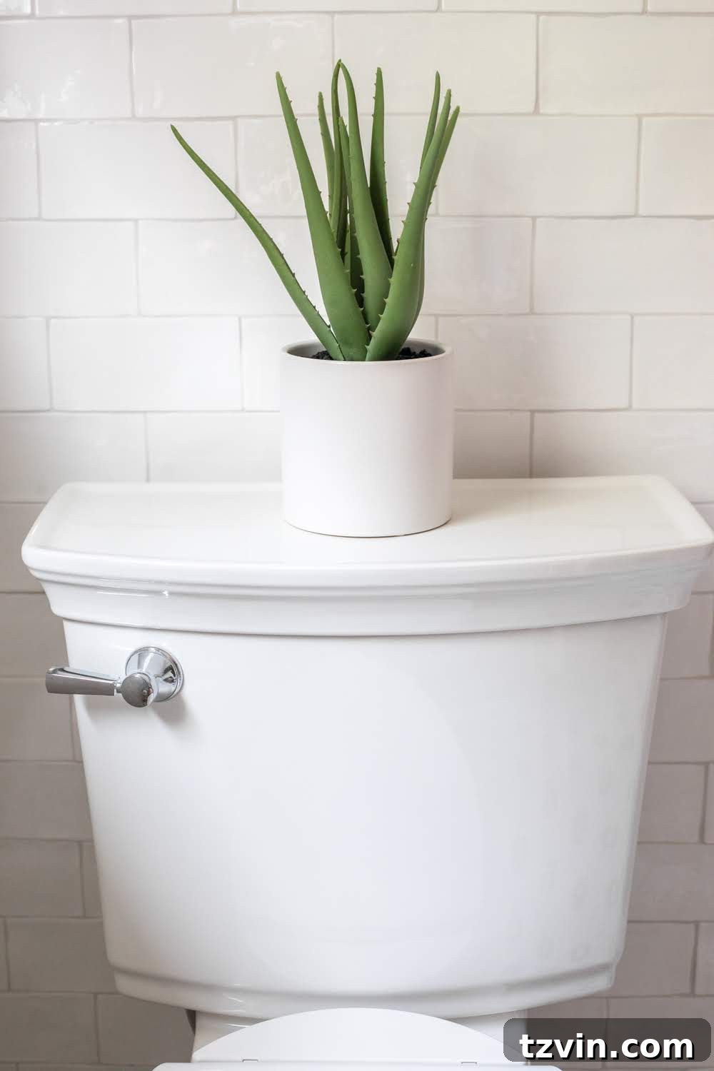 Tiny Humans Big Bathroom Makeover 16 Handmade subway tile accent wall behind the self-cleaning toilet