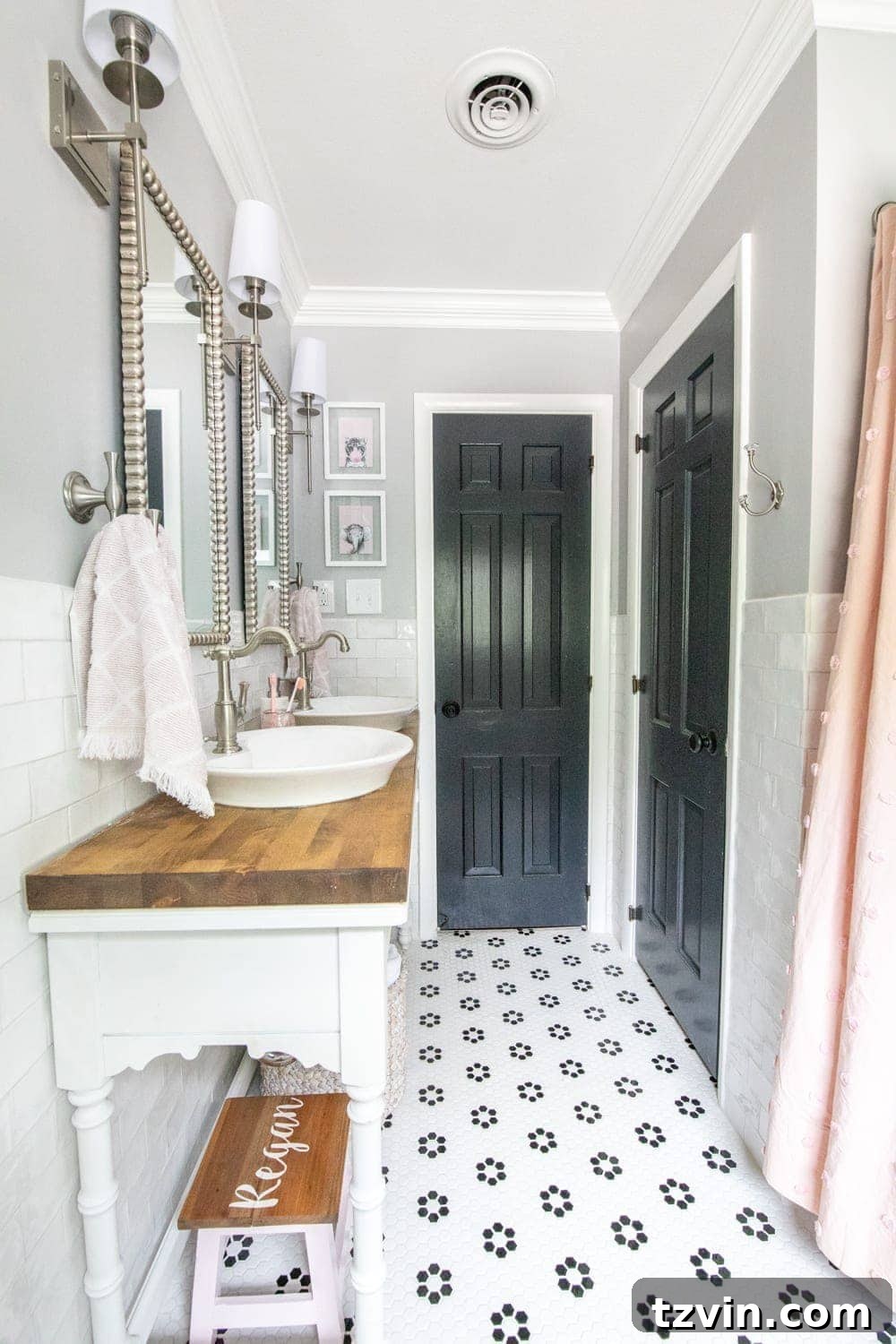 Tiny Humans Big Bathroom Makeover 21 After image of the whimsical kids bathroom with open vanity, dual sinks, and retro floor tile