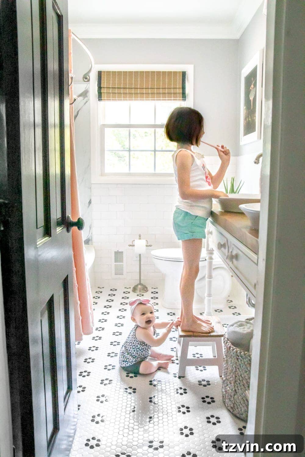 Tiny Humans Big Bathroom Makeover 22 Full view of the finished whimsical classic kids bathroom makeover for little girls