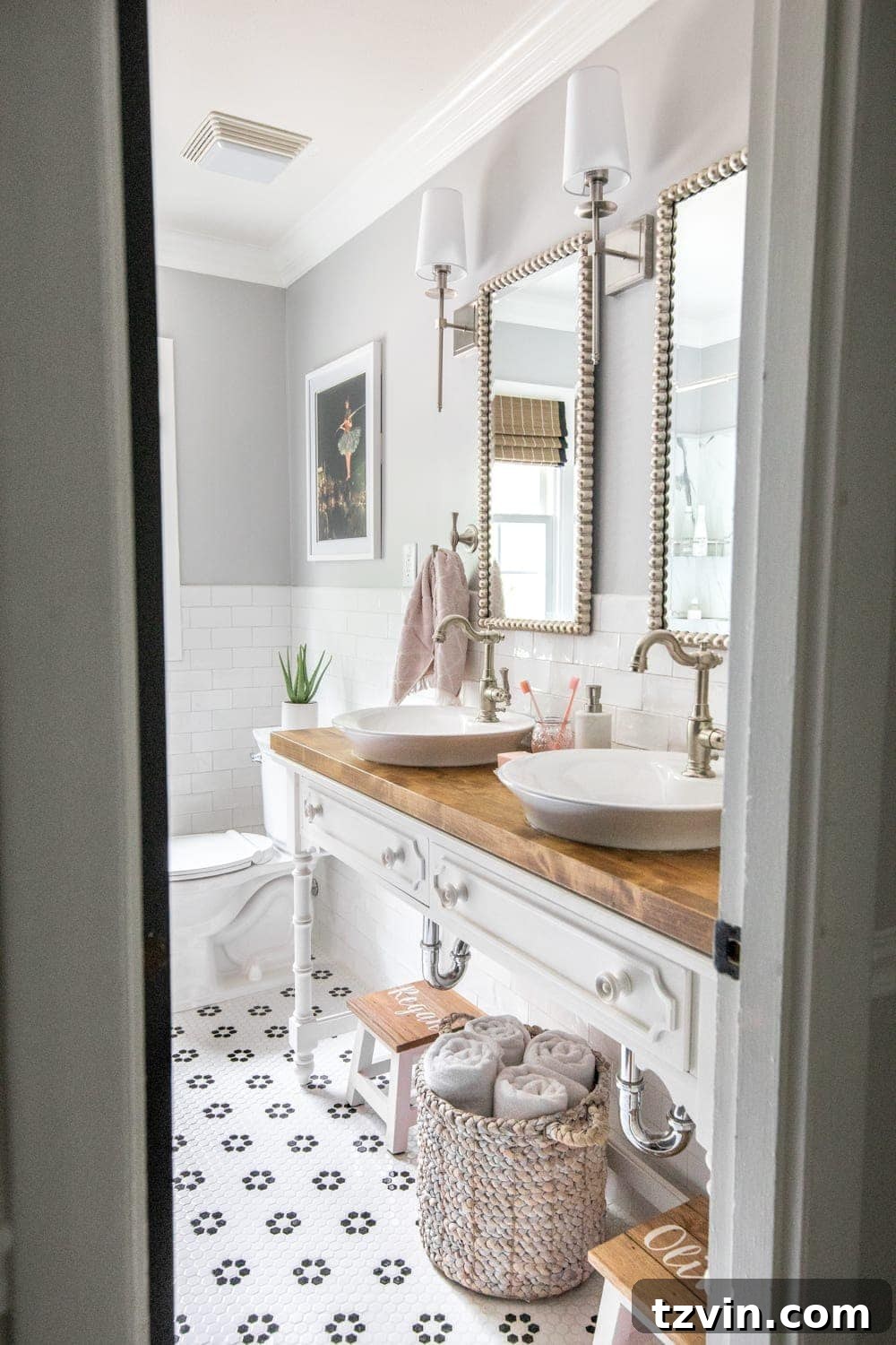 Tiny Humans Big Bathroom Makeover 5 Open vanity table with two step stools and vessel sinks in a freshly renovated kids bathroom