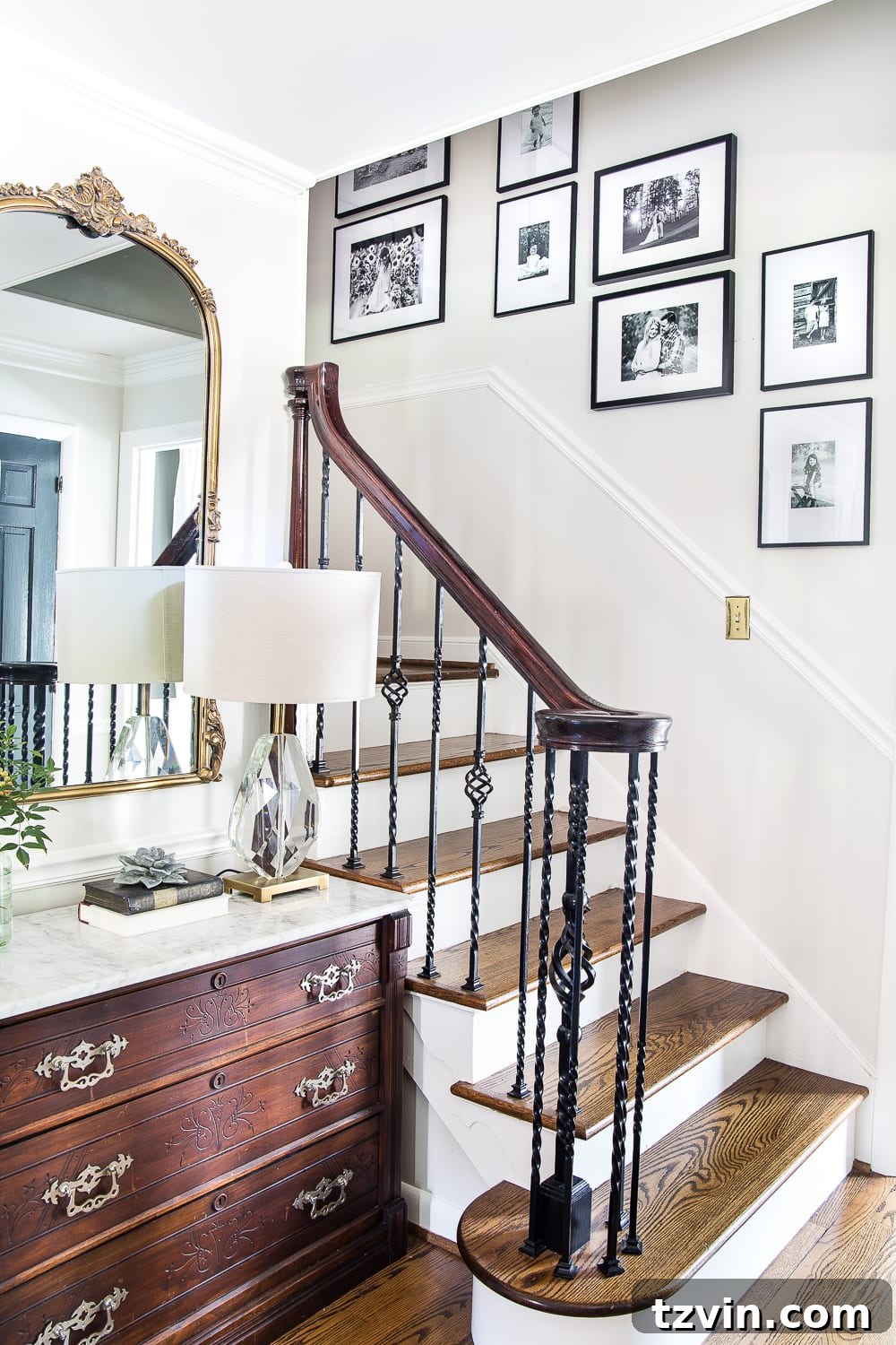 8 Personalized Art Ideas to Warm Your Home 14 Sentimental art idea - black and white family photo gallery wall on a stairway, creating a timeless display