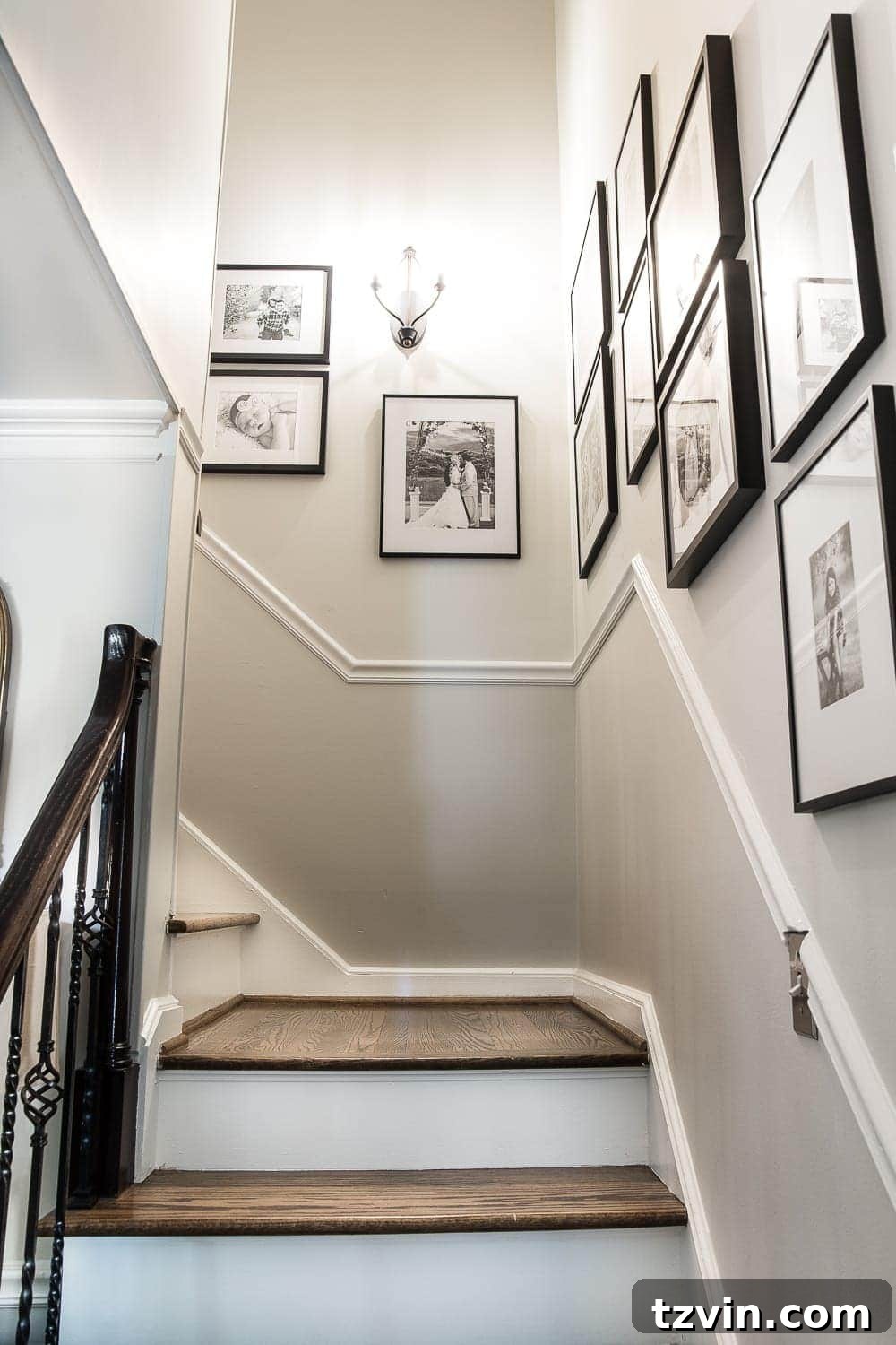 8 Personalized Art Ideas to Warm Your Home 15 Sentimental art idea - detail of a stairway gallery wall with favorite family photos, showcasing varied frames