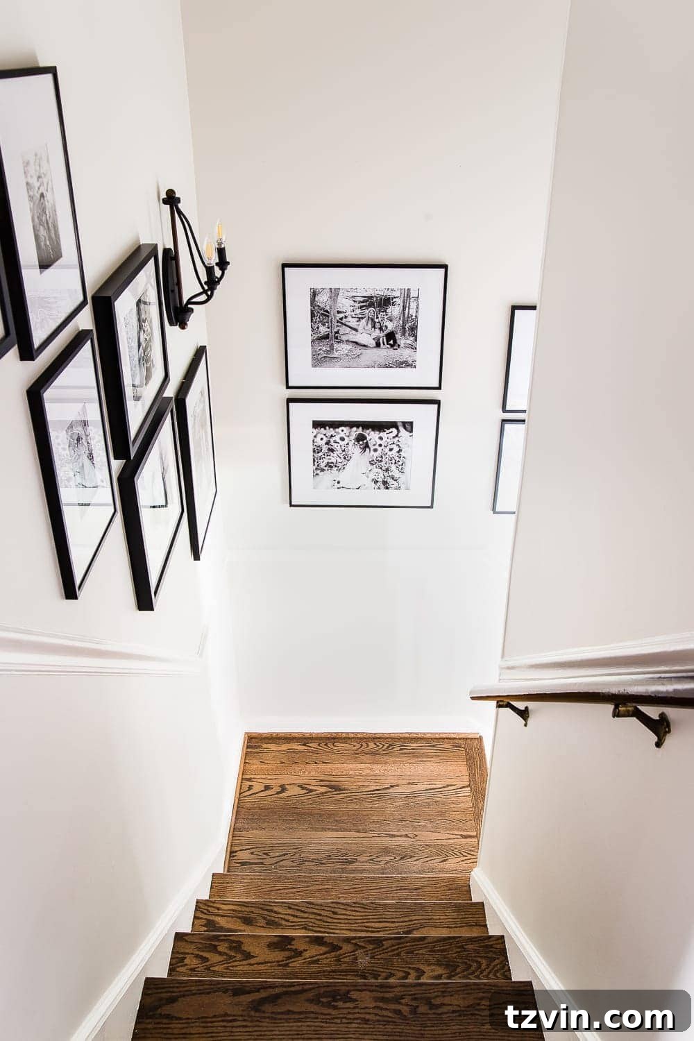 8 Personalized Art Ideas to Warm Your Home 16 Sentimental art idea - another view of a black and white family photo gallery wall, adding personal touch to home decor