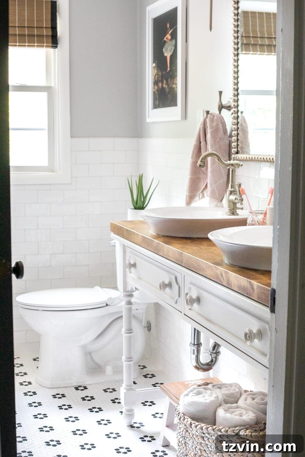 Girls' Bathroom Decor Details & Sources | Console table converted into a vanity with vessel sinks and retro flower floor tile