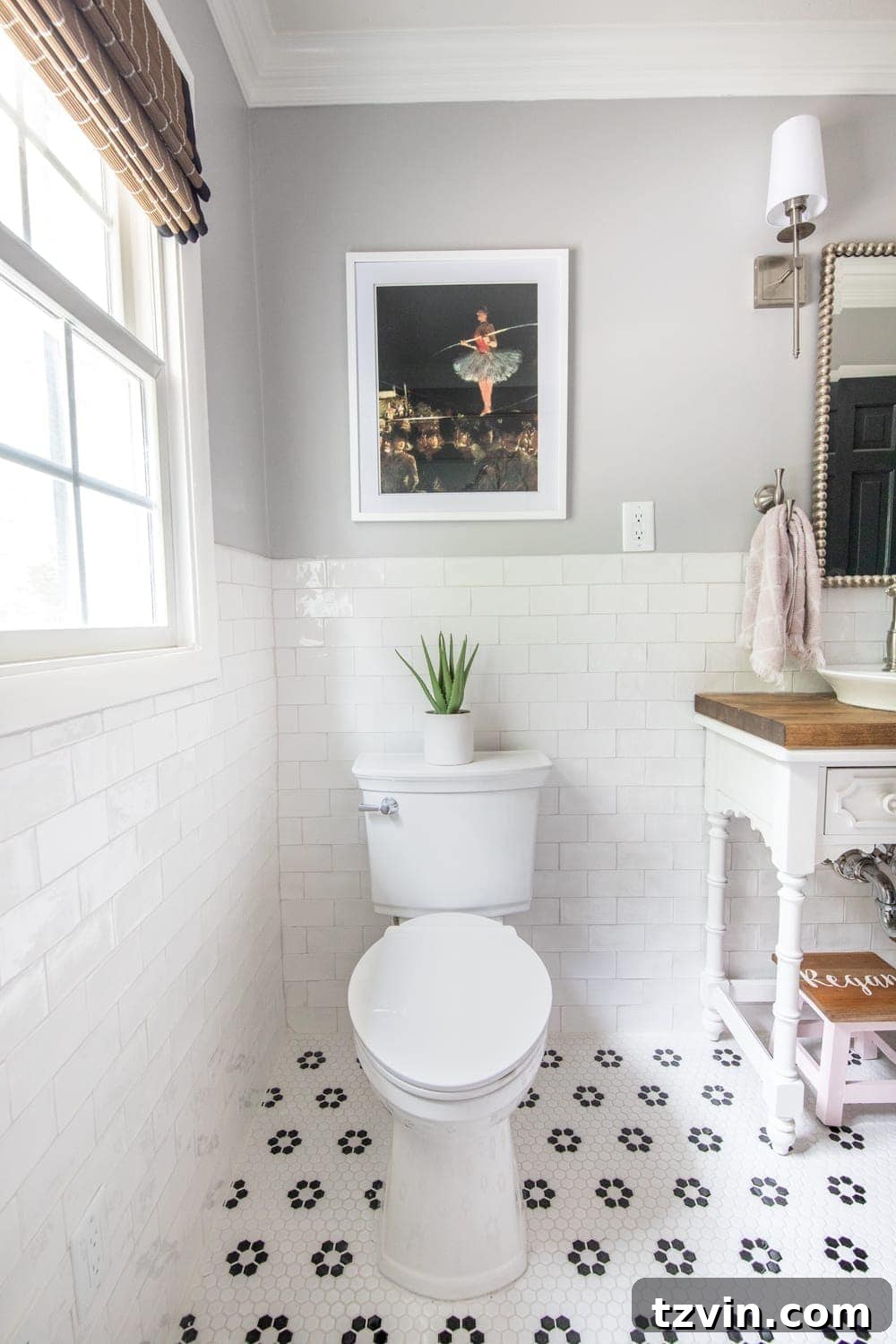 Girls' Bathroom Decor Details & Sources | Self cleaning toilet, retro flower floor tile, handmade subway wall tile, and vintage tightrope walker art