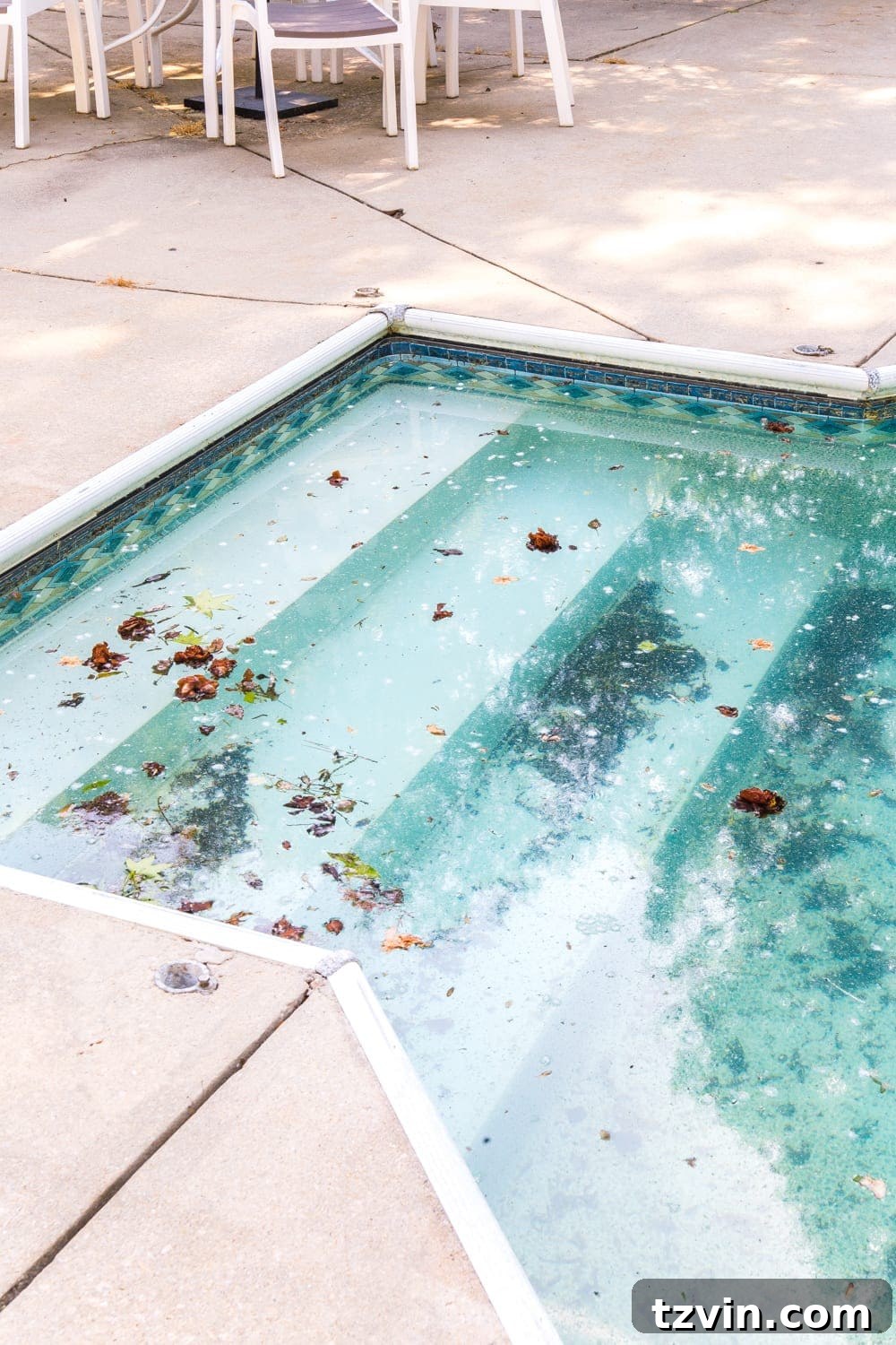 Before image of the old pool liner showing discoloration and age