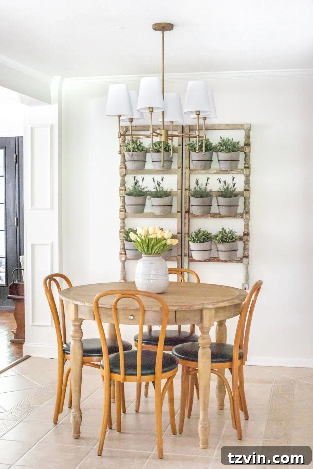 Chandelier Makeover: Our Favorite Brass Spray Paint 11 The newly installed aged brass chandelier in the breakfast nook