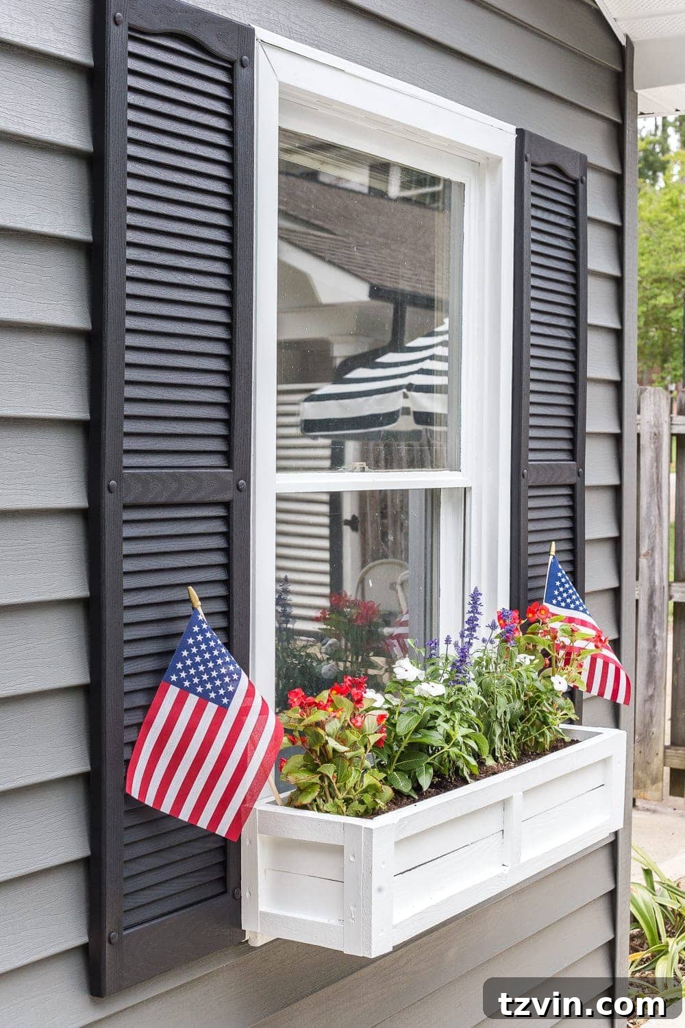 From Scraps to Blooms: DIY Window Planter 24 DIY window box using scrap wood with red, white, and blue patriotic flowers for July 4th