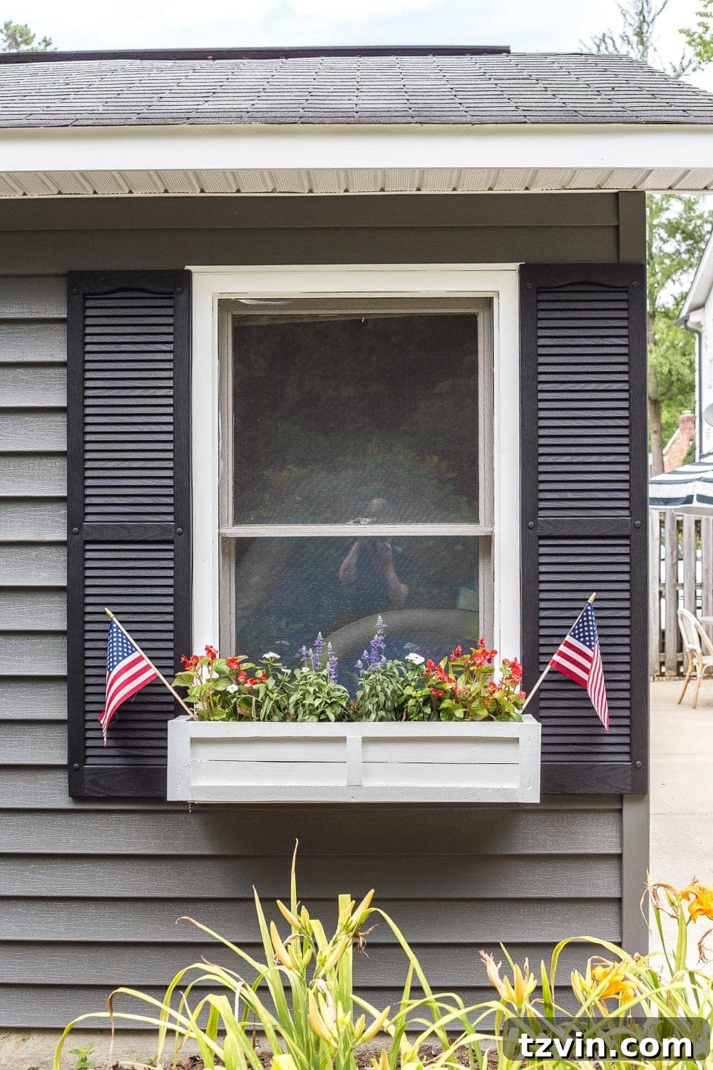 From Scraps to Blooms: DIY Window Planter 25 DIY window box using scrap wood with red, white, and blue patriotic flowers for July 4th