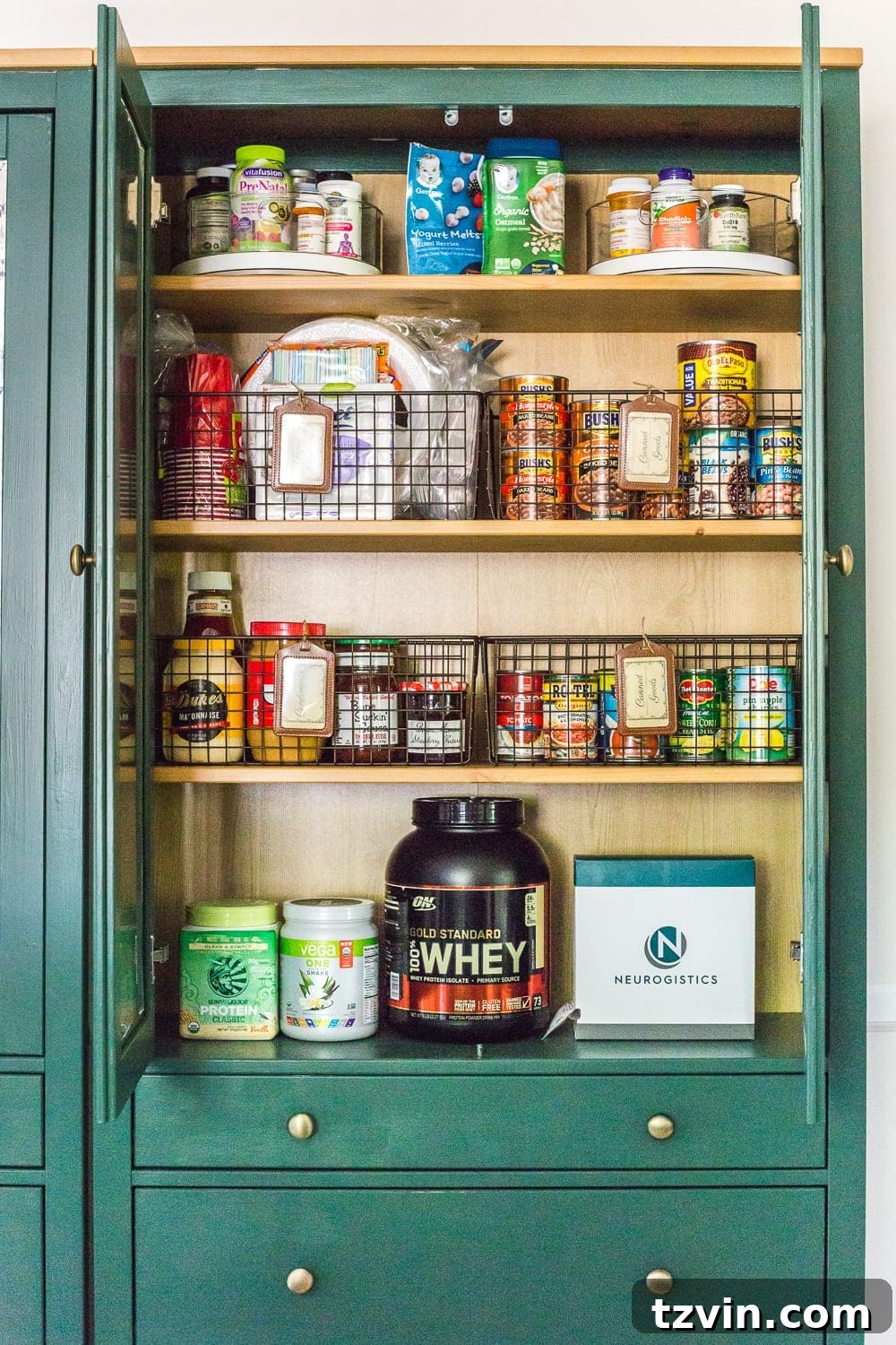 Ultimate IKEA Hemnes Pantry Cabinet Organization 5 Detailed view of a well-organized IKEA Hemnes pantry with labeled wire baskets for various food categories, ensuring easy access and inventory.