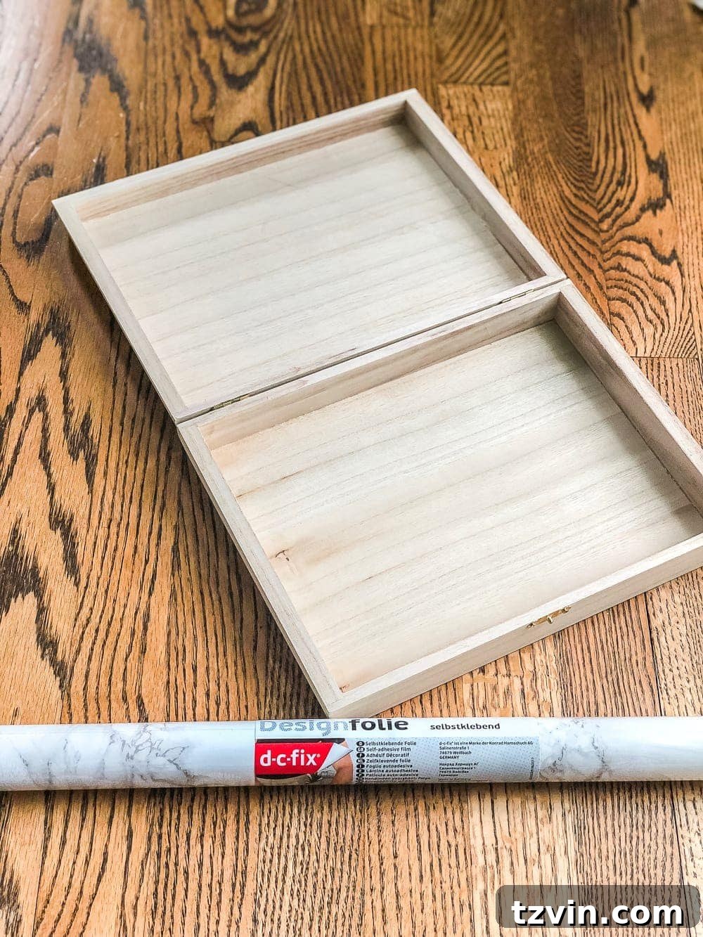 Elegant Faux Marble Remote Organizer: A Cigar Box Upcycle 3 How to wrap a cigar box with contact paper to repurpose into a decorative remote control holder for a coffee table. #remotecontrolholder #coffeetabledecor #DIYhomeorganization