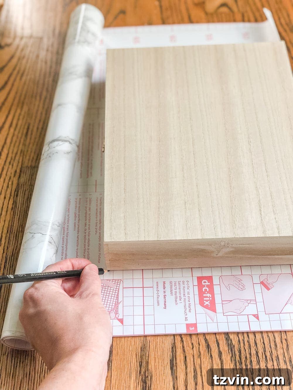 Elegant Faux Marble Remote Organizer: A Cigar Box Upcycle 4 How to wrap a cigar box with contact paper to repurpose into a decorative remote control holder for a coffee table. #remotecontrolholder #coffeetabledecor #DIYcrafts