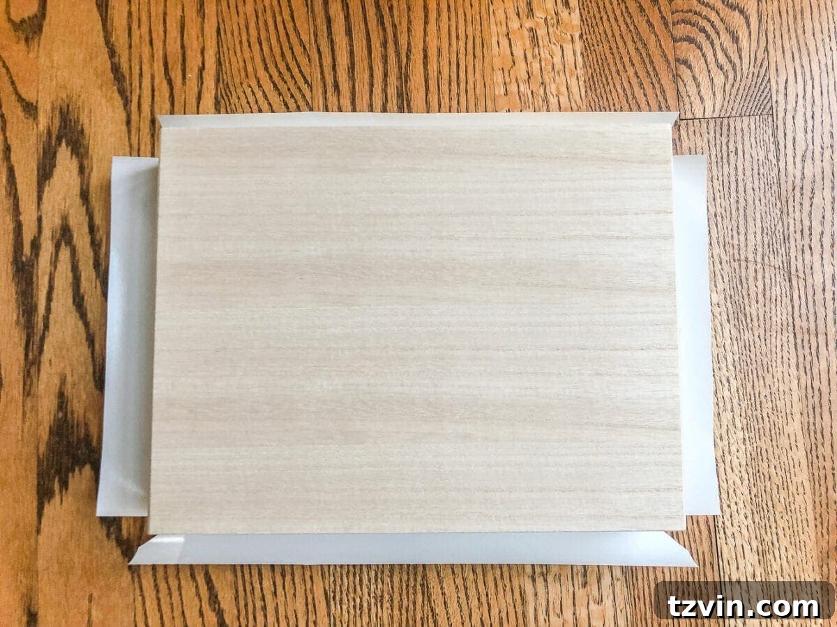 Elegant Faux Marble Remote Organizer: A Cigar Box Upcycle 7 How to wrap a cigar box with contact paper to repurpose into a decorative remote control holder for a coffee table. #remotecontrolholder #coffeetabledecor #homedecorideas