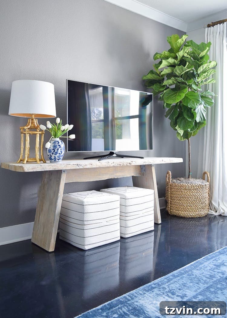 Beyond the Screen 12 Ways to Style Your TV Space 16 Tall plant used to add visual height and distract from a television