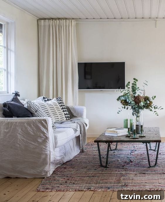 Beyond the Screen 12 Ways to Style Your TV Space 7 Decorative curtains used to hide a television on the wall