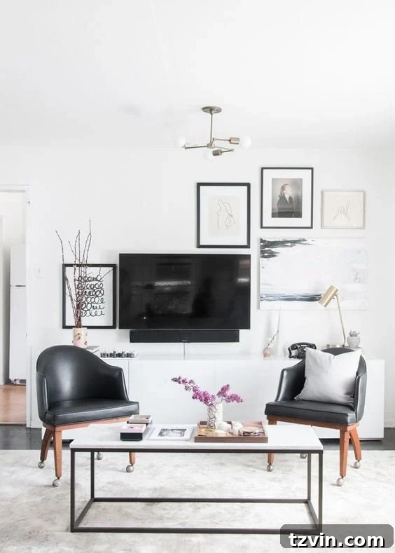 Beyond the Screen 12 Ways to Style Your TV Space 8 Eclectic gallery wall incorporating a television as part of the art display
