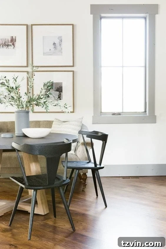 Elevate Your Space: Paint Colors Designed for Gray Trim 3 A chic bedroom with dark gray trim providing a dramatic contrast to crisp white walls, showcasing contemporary elegance.