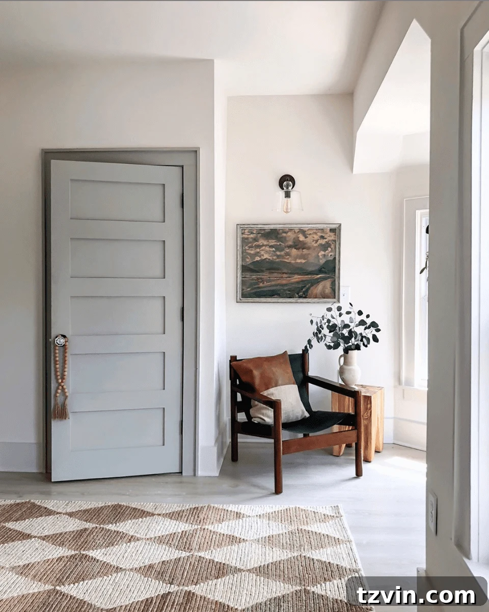 Elevate Your Space: Paint Colors Designed for Gray Trim 5 Contemporary hallway with a subtle taupe trim against off-white walls, providing a soft architectural delineation.