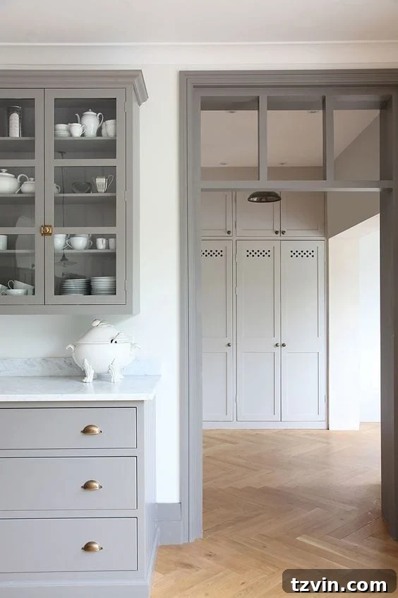 Elevate Your Space: Paint Colors Designed for Gray Trim 6 Bedroom with unique taupe trim framing windows and doors, adding character to a minimalist design.