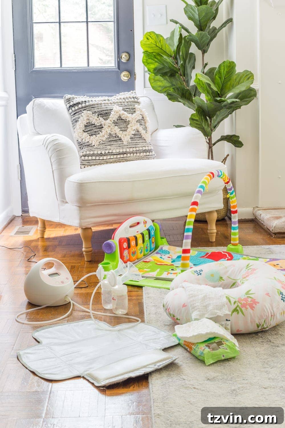 Exclusive Pumping Hack - set up a "cockpit" on the floor with a pump, Boppy for propped bottle feeding, diaper changing pad, and play mat.