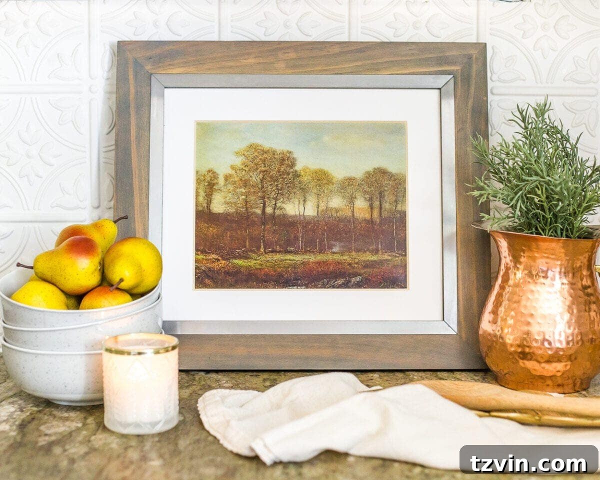 A beautiful autumn landscape art printable, perfect for budget-friendly fall decor, easily printed from home.