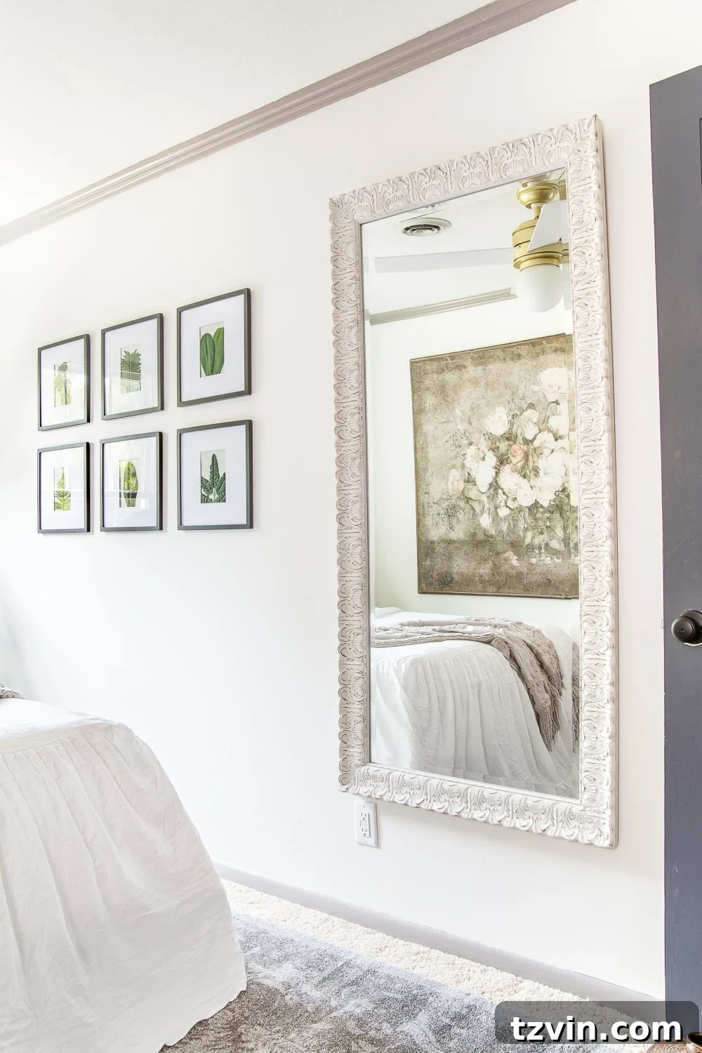 Our Guest Retreat Transformation Unveiled 14 A full-length mirror in the guest bedroom, strategically placed to reflect light and create a sense of spaciousness, also serving as a convenient dressing area.