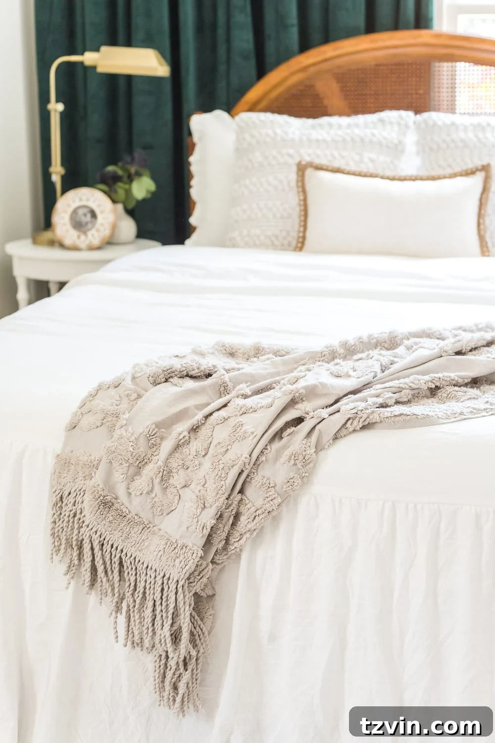 Our Guest Retreat Transformation Unveiled 16 Detailed shot of the bed in the guest bedroom, showcasing the comfortable white bedding from Walmart and the elegant vintage-style art above.