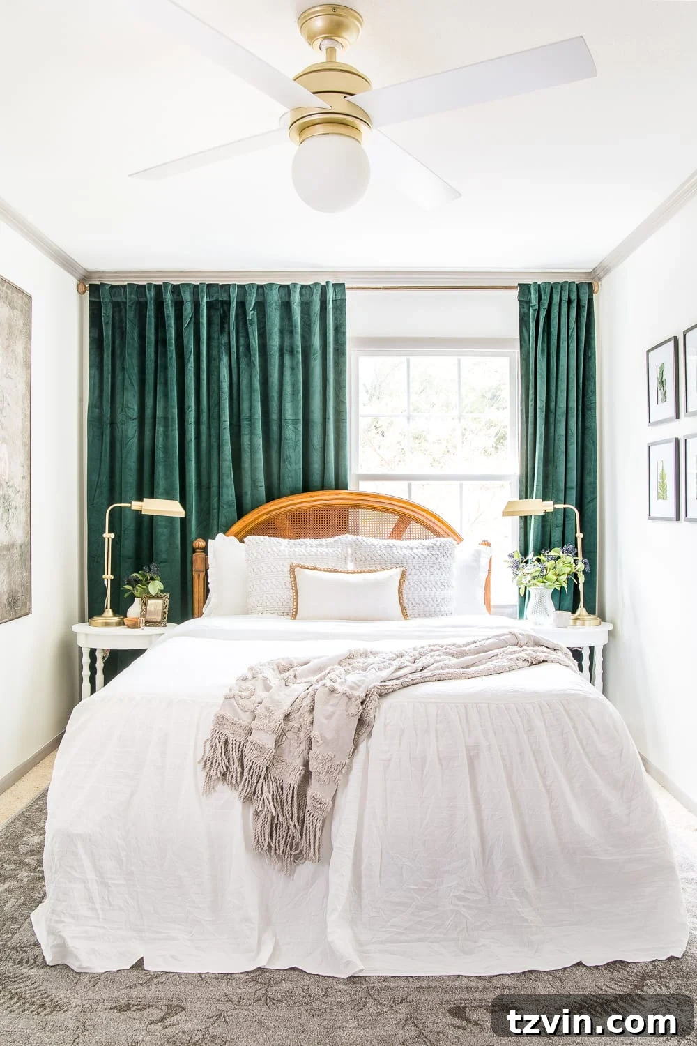 Our Guest Retreat Transformation Unveiled 3 The transformed guest bedroom, showcasing a luxe vintage chic aesthetic with a comfortable queen bed, rich green velvet curtains, and an inspiring art piece. After image.