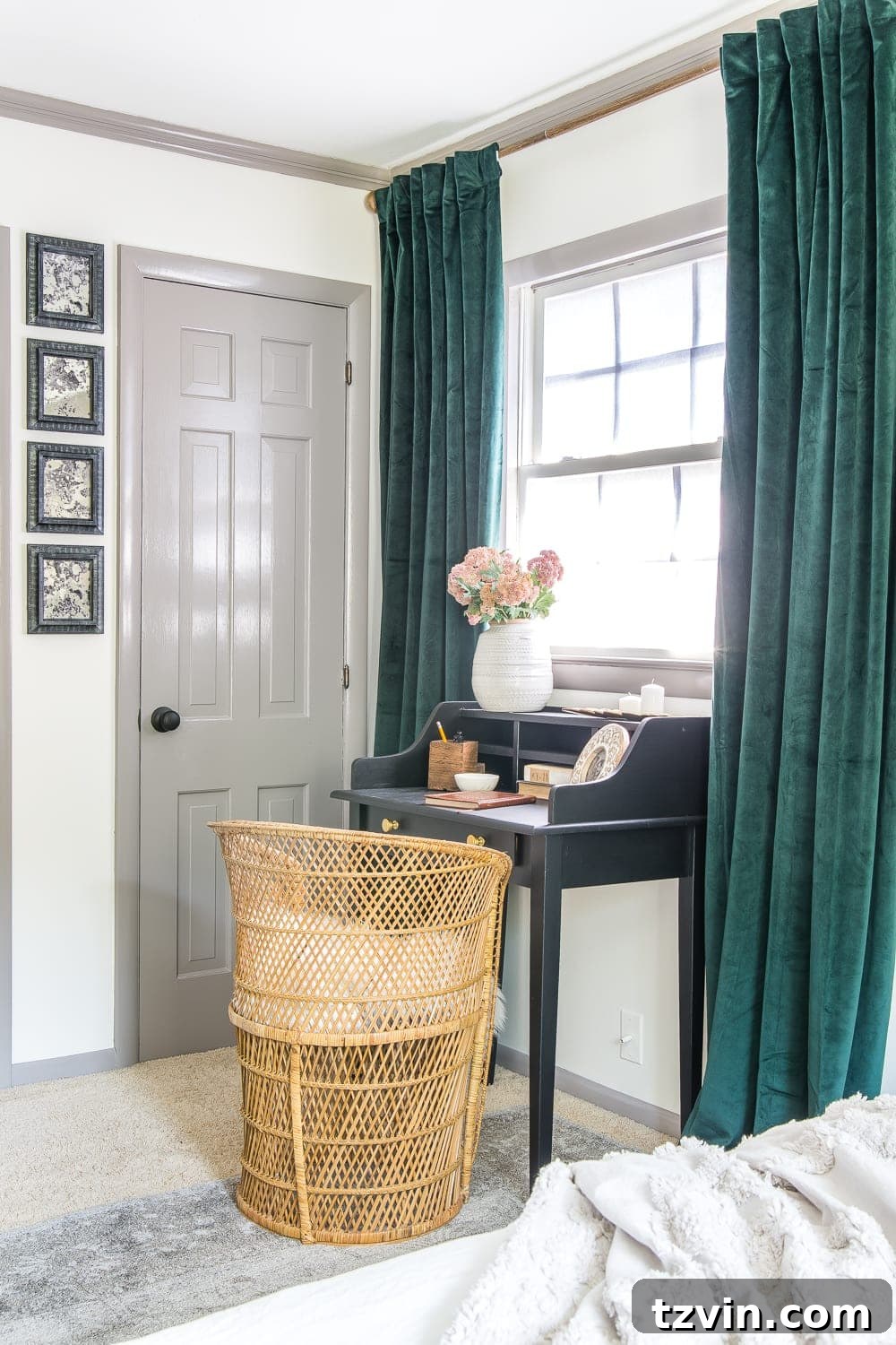 Our Guest Retreat Transformation Unveiled 8 A charming vintage writing desk and a thrifted chair in the guest bedroom, providing a functional workspace with chic flair.