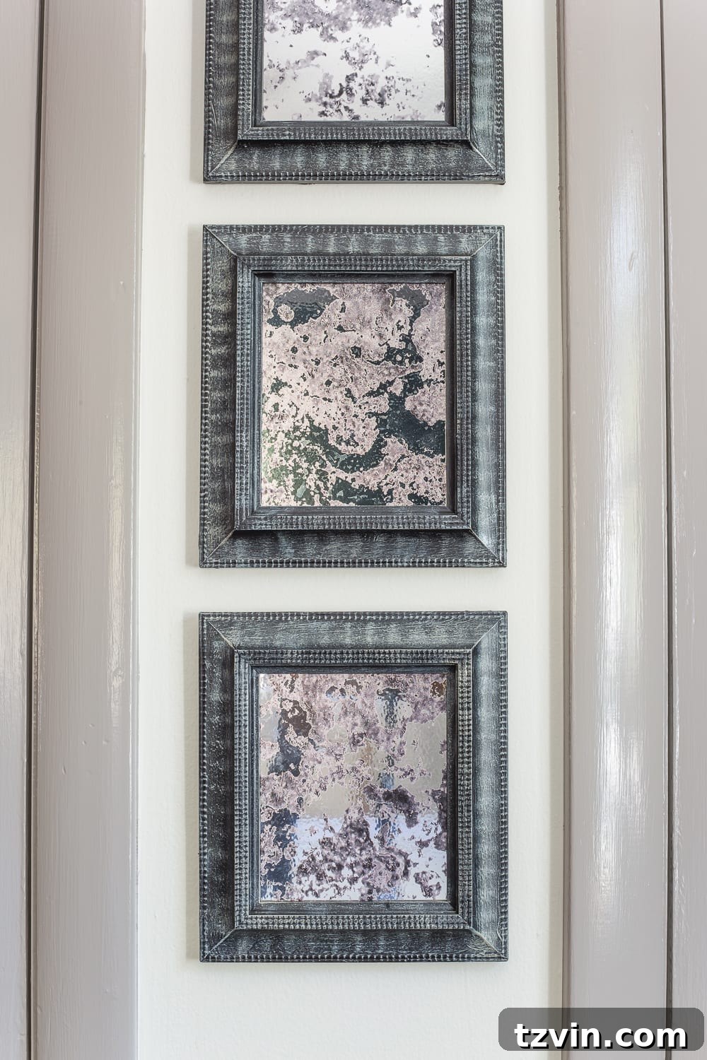 Upcycling Old Frames Into Stunning Antique Mirrors 9 Applying antique mirror film to glass with spray bottle