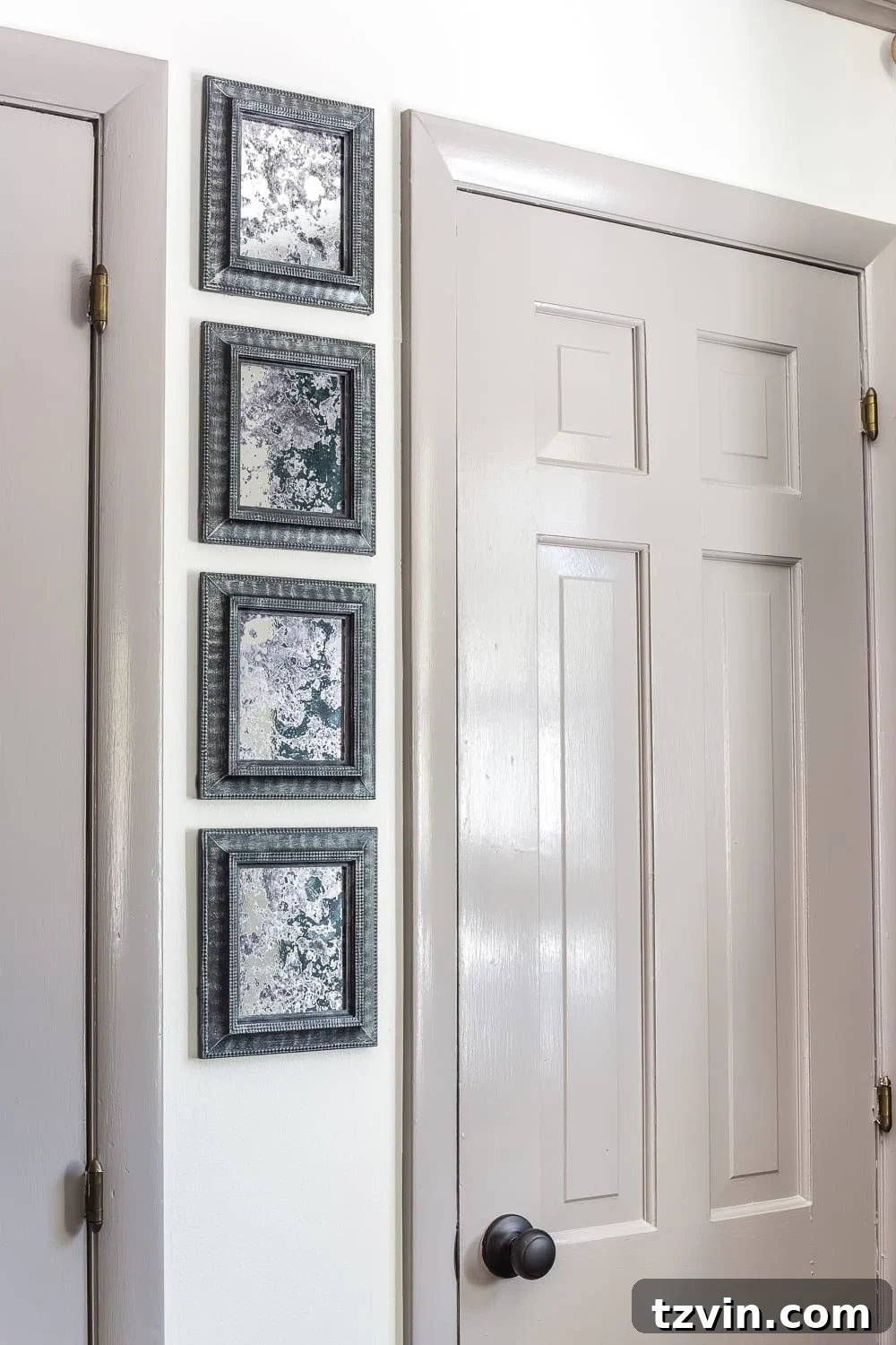 Upcycling Old Frames Into Stunning Antique Mirrors 10 Squeegeeing antique mirror film onto glass to remove bubbles