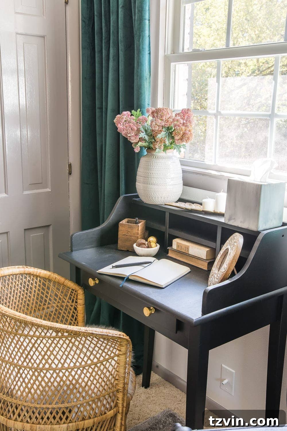 A small desk or vanity area in a guest bedroom with a mirror, providing a dedicated space for guests to get ready or work.